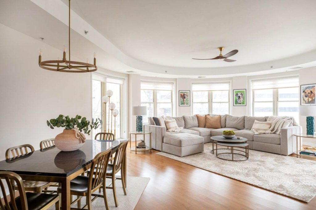 Open concept living area with large sofa in a rounded living room